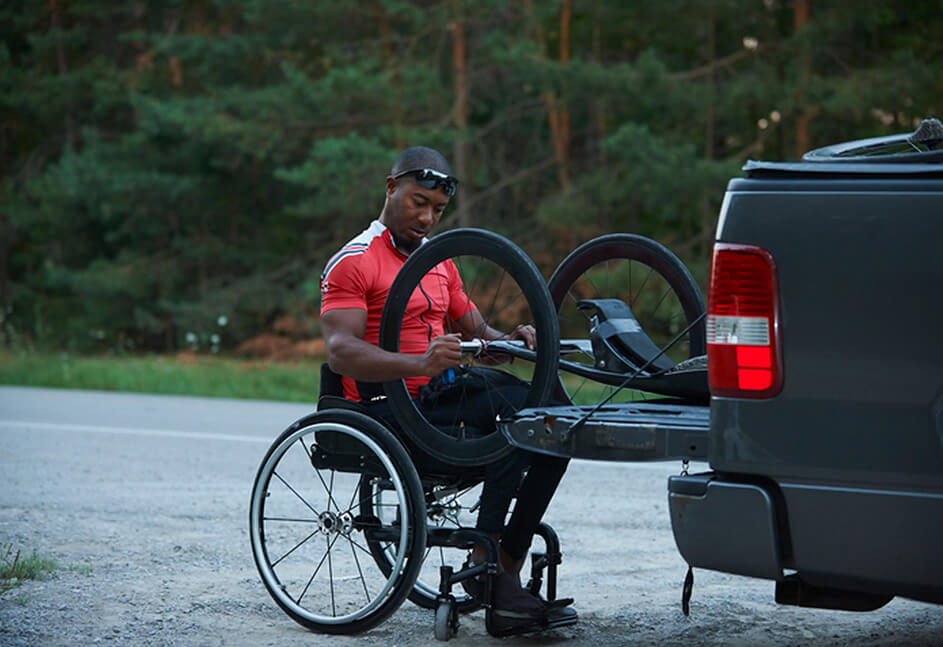 Man in Wheelchair loading truck